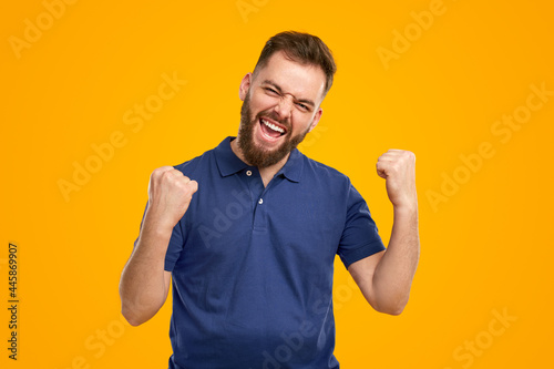 Excited bearded man celebrating victory