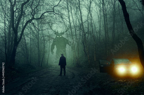 A horror concept. Of a man next to a car looking at a monster with glowing eyes. In a spooky, winter forest at night With a grunge, textured edit