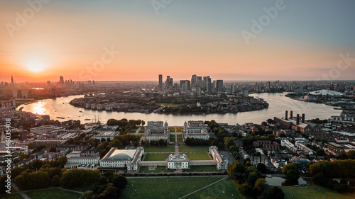 Sunset Aerial bird's eye view photo taken by drone of Greenwich park with views to Canary Wharf, Isle of Dogs, London, United Kingdom