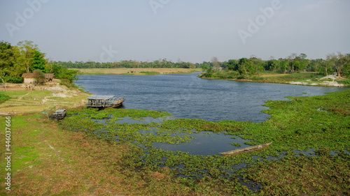 Scenic rural landscape with water and trees on Brahmaputra river island Majuli, Assam, India