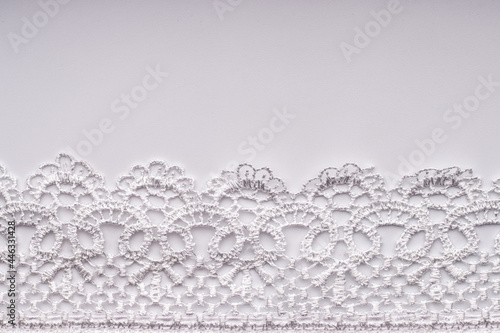 White lace on a white background.