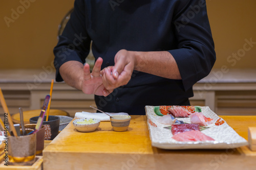 Close up of Japanese chef preparing sushi in japanese style.Omakase couse.