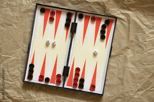 backgammon lie on brown paper, game