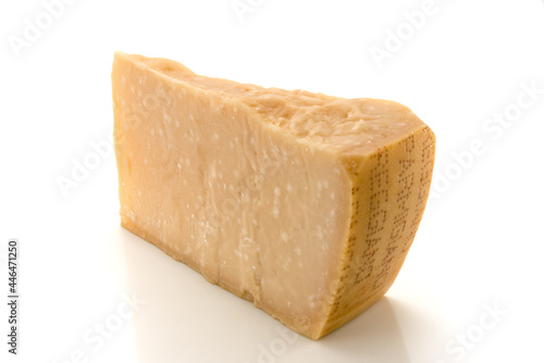 Piece of Parmesan cheese, original Italian cheese isolated on white, copy space
