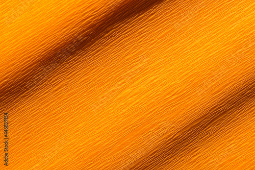 Wrinkled orange crepe paper background texture