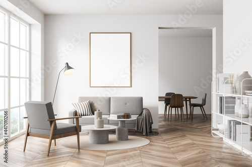 Mock up empty posters on the wall. Modern living room interior. Wooden floor and stylish furniture. Concept of contemporary design.