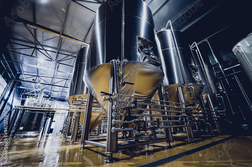 Rows of steel tanks for beer fermentation and maturation in a craft brewery