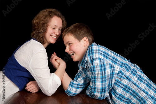 Teenagers arm-wrestling
