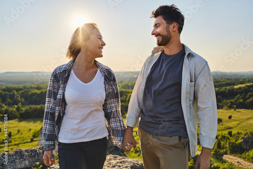 Young couple enjoying summer hike in mountains