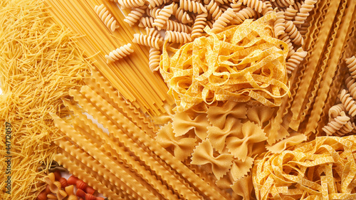 Assorted varieties of pasta background. Mix macaroni