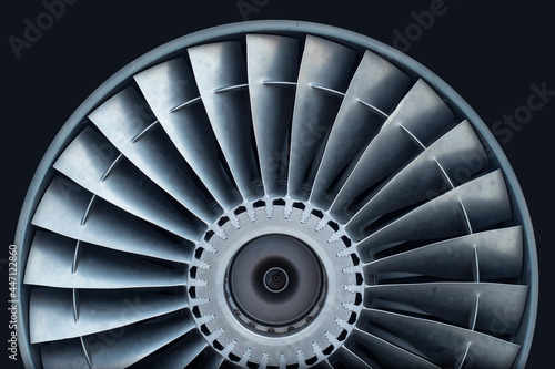Close-up fragment of a shiny aircraft turbo jet engine blades with copy space: straight view