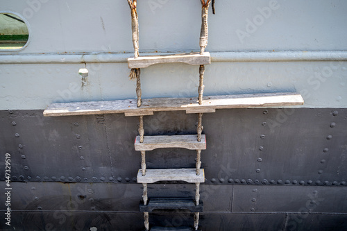 pilot ladder on old cargo vessel with reveted hull for the embarking and disembarking pilots