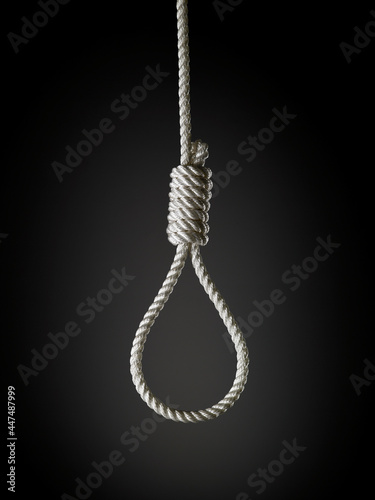 loop of white rope on a black background