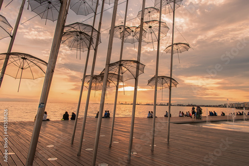 The Umbrellas, by Giorgios Zogolopoulos located at the seafront and constructed in 1997. He was Greek sculptor which works adorn public places and official buildings. Thessaloniki, Greece, Jun 2014