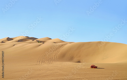 Dune buggies running on the amazing Huacachina sand dunes in Ica region, Peru, South America