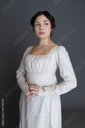 A Regency woman wearing a printed cotton dress