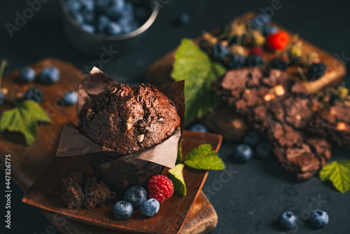 Chocolate muffin. Muffin with chocolate and fruits. Fruit muffin.