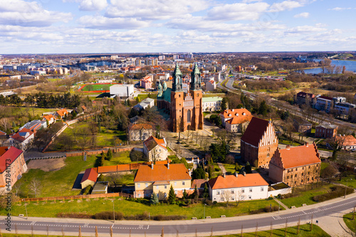 Aerial view of island of Ostrow Tumski in Poznan with oldest Polish cathedral of St. Peter and St. Paul on sunny spring day ..