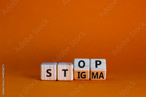 Stop stigma symbol. Turned wooden cubes with words stop stigma. Beautiful orange background. Medical and stop stigma concept. Copy space.
