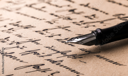 Handwritten letter and fountain pen