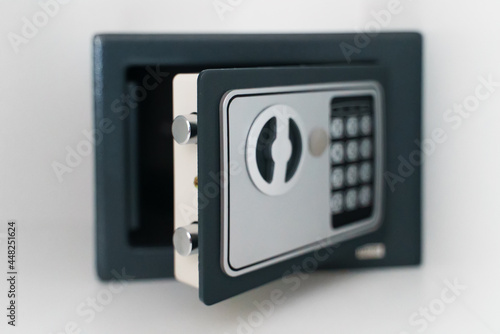 Black small home or hotel safe with keypad.