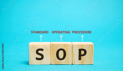 Wooden blocks with the word SOP ( Standard operating procedure ). Instructions to assist employees in complex routine operations. Business concept