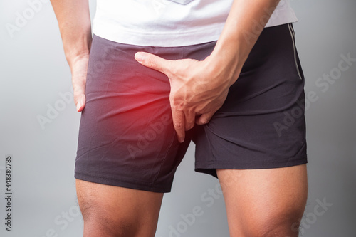 adult male with muscle pain during running. runner have leg ache due to Groin Pull, liotibial Band Syndrome (ITBS) or prostate cancer. Sports injuries and medical concept