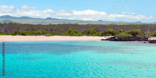 Panorama of Galapagos coral reef and beach by Seymour North Island for snorkeling, Galapagos national park, Ecuador.