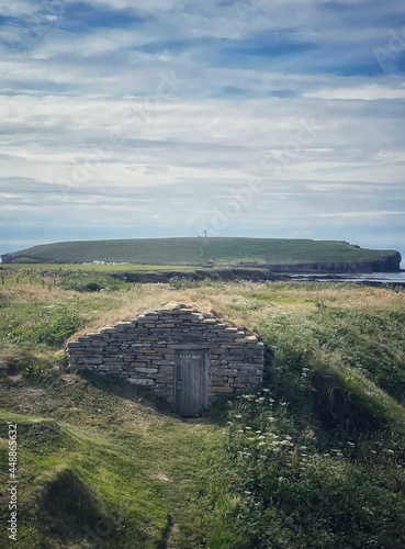 Fisherman Hut at Skiba Geo with Brough of Birsay in the distance.