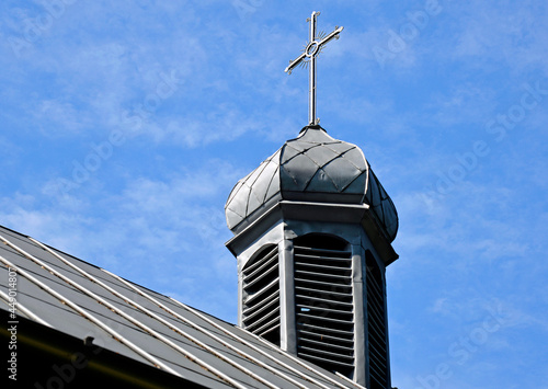 The Catholic branch church of Saint Joseph, built of wood in 1780 in the village of Ślubowo in Masovia, Poland. The photo presents a general view of the temple and close-up of architectural details.