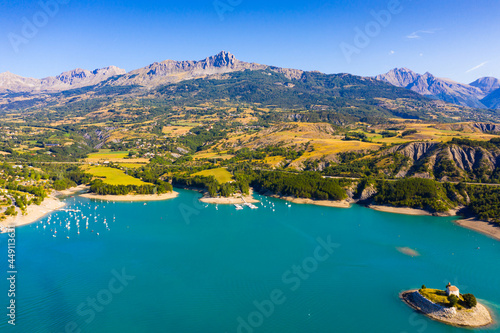 Picturesque view over artificial lake of Lac de Serre-Poncon in departments of Hautes-Alpes and Alpes-de-Haute-Provence, France