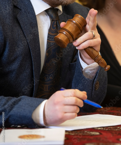 auctioneer holding gavel at auction