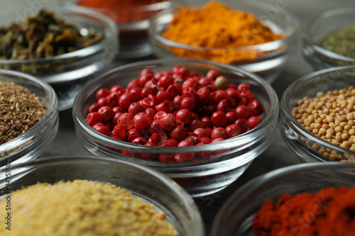 Set of different spices in glass bowls