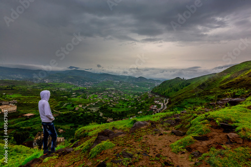 beautiful landscape view to Ibb City, Yemen. traveler standing on the top of mountain with misty foggy landscape watching the beauty from countryside 