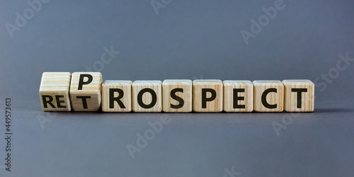 Prospect or retrospect symbol. Turned a cube and changed the word 'retrospect' to 'prospect'. Beautiful grey background. Business and prospect or retrospect concept. Copy space.
