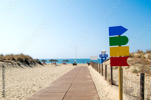 Wooden walkway to the beach of Casita Azul in Isla Cristina, Huelva, Andalusia, Spain
