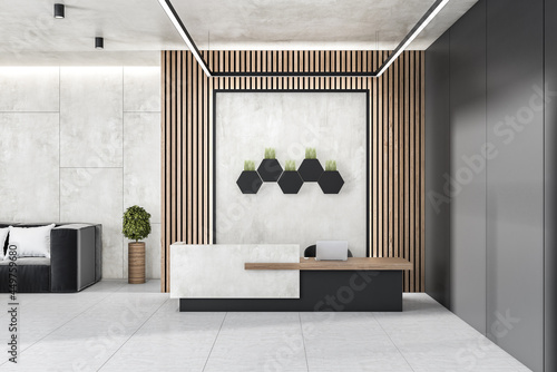 Modern concrete and wooden office lobby interior with reception desk, laptop, decorative plants and other items. 3D Rendering.