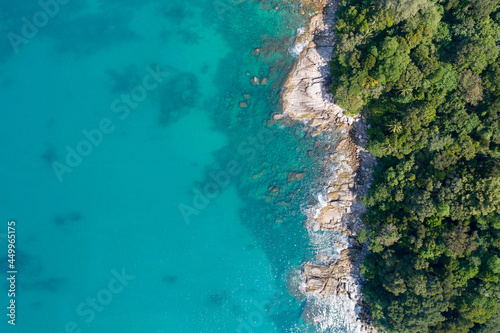 Amazing Sea aerial view Top down seashore nature background Beautiful Tropical beach with rocky mountains and turquoise clear water of Phuket Thailand ocean at sunny summer day Landscape background.