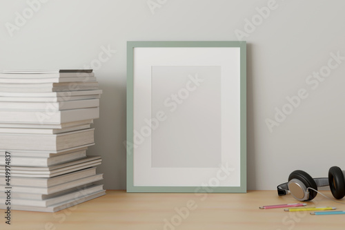 Blank picture frame mock up on the table with a book in white living room design. 3d rendering.