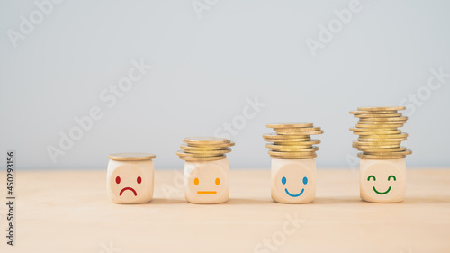 emotion face on stack of coins, saving money, deposit, wealthy, profit, cash for health budget or insurance concept