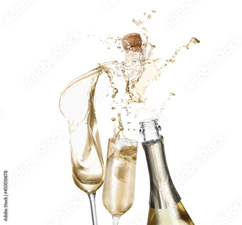 Sparkling wine splashing out of bottle and glasses on white background