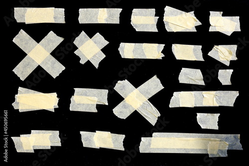 Collection of adhesive tape pieces on black background