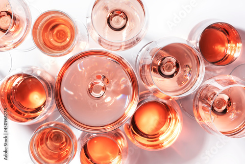 Rose wine of different shades in glasses on white background. Rosado, rosato or blush wines tasting