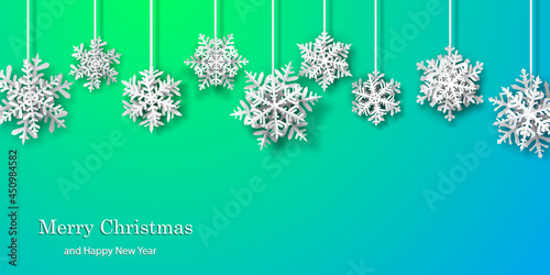 Christmas background of paper snowflakes with soft shadows, white on turquoise background