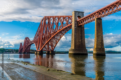 A view from a slipway in Queensferry of the Forth Railway bridge over the Firth of Forth, Scotland on a summers day