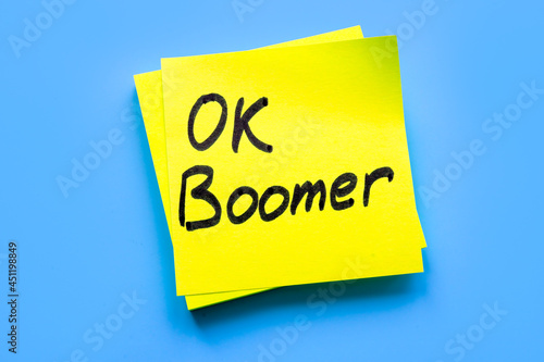 OK boomer words on the yellow piece of paper.
