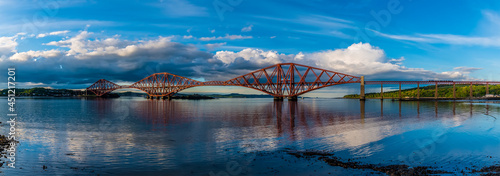A view from the harbour at Queensferry towards the Railway Bridge over the Firth of Forth, Scotland on a summers day