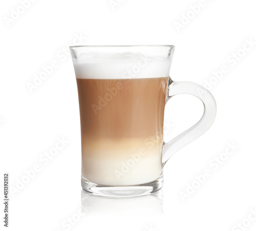 Hot coffee with milk in glass cup isolated on white