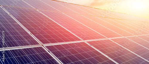 closeup photovoltaic panels which installed on the rooftop of the building, concept for storing and using natural power from the sunlight to care about human environment over the world.