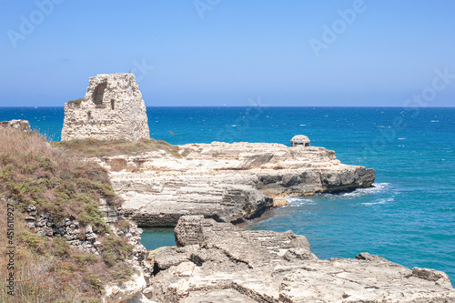 Torre di Roca Vecchia on a white cliff of Italian adriatic coast by Mulino d'Acqua Beach by Grotta della Poesia
